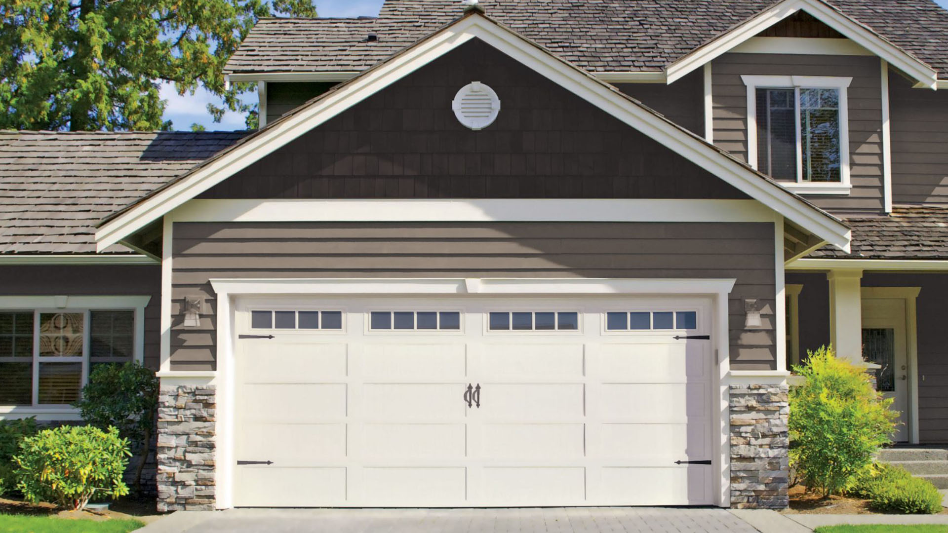 Garage positioned in center of home