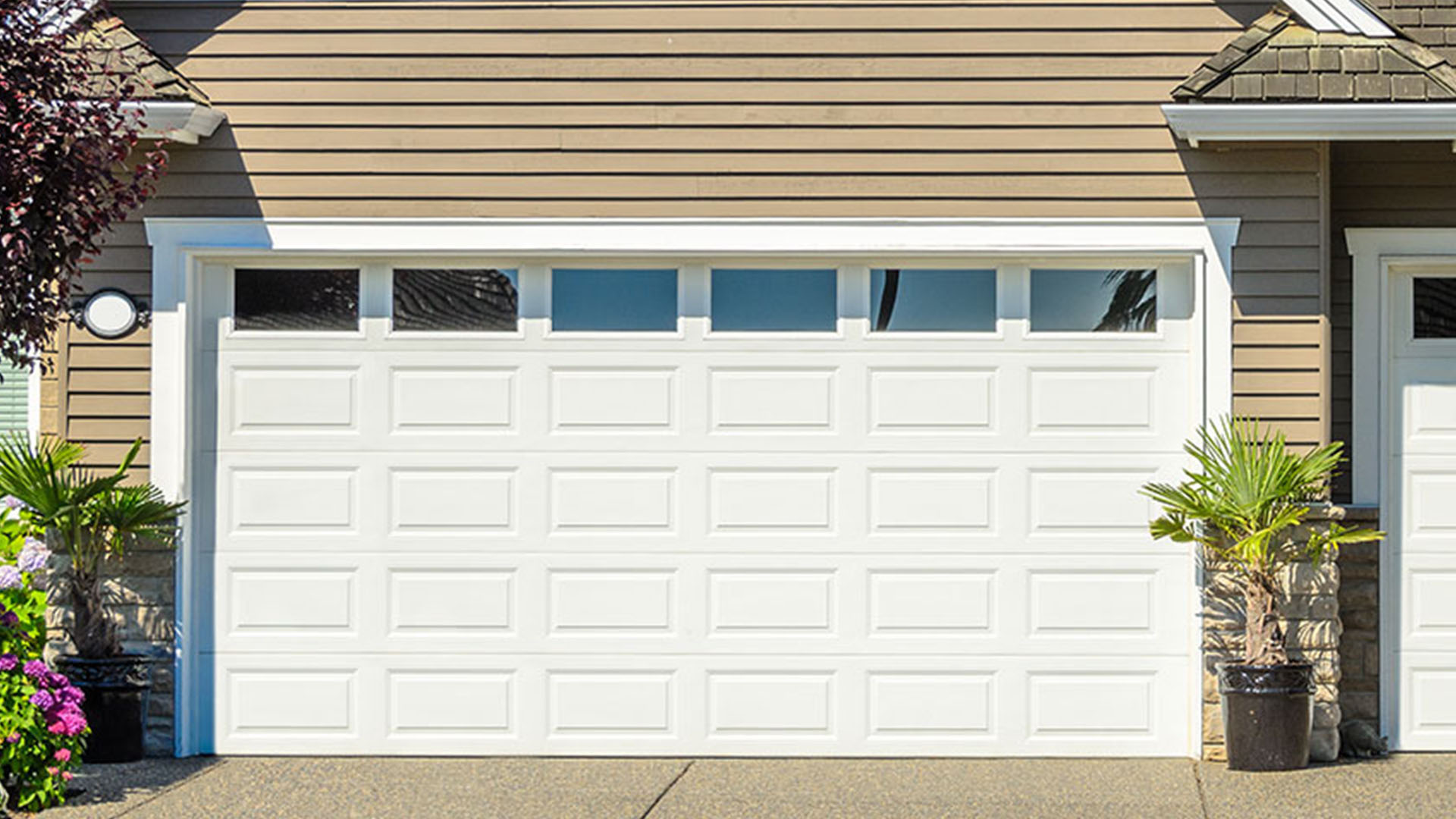 Tan garage with white door